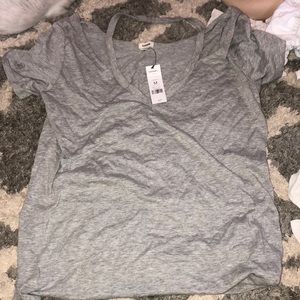 grey t shirt with cutout around the neck
